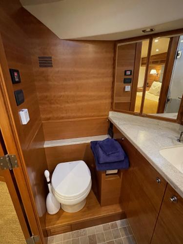Slide: The Image of Luxurious bathroom in 2012 Coastal Craft 56 yacht with wooden cabinetry and modern fixtures. - 44