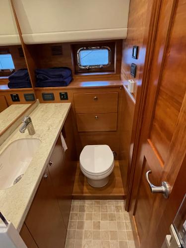 Slide: The Image of Luxurious bathroom in 2012 Coastal Craft 56 yacht with wooden cabinetry and modern fixtures. - 46