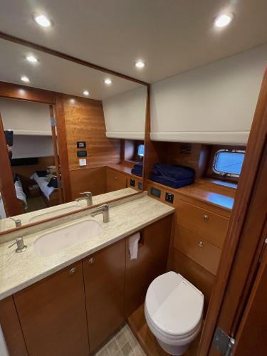 Slide: The Image of Luxurious bathroom in 2012 Coastal Craft 56 yacht, featuring modern fixtures and wooden cabinetry. - 47