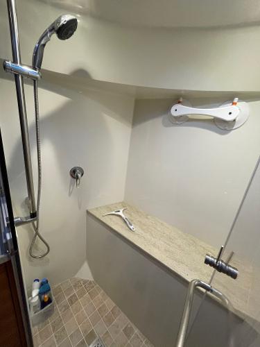 Slide: The Image of Shower area in 2012 Coastal Craft 56 yacht with modern fixtures and tiled floor. - 48