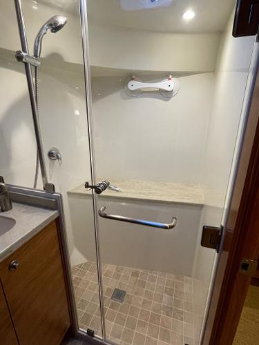 Slide: The Image of Luxurious shower in 2012 Coastal Craft 56 yacht with glass door and modern fixtures. - 49