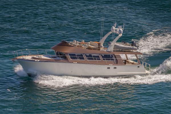 Slide: The Image of Luxurious 2012 Coastal Craft 56 yacht cruising on open water. - 8