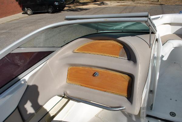 Slide: The Image of 1998 Cobalt 200 boat interior with wooden dashboard and seating area. - 27