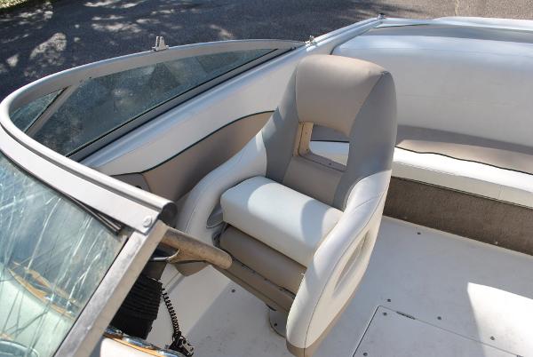 Slide: The Image of 1998 Cobalt 200 boat interior with steering wheel and seating. - 31