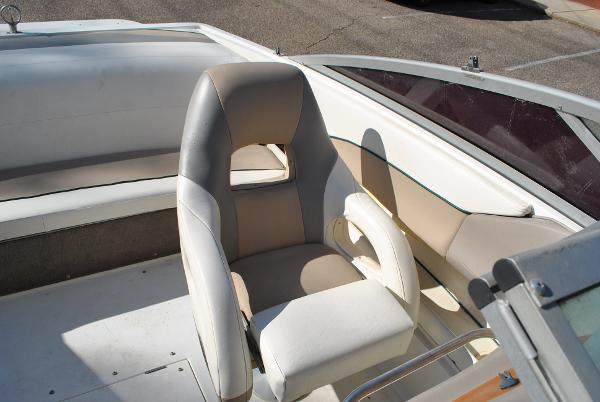 Slide: The Image of 1998 Cobalt 200 boat interior with beige and white seating. - 32