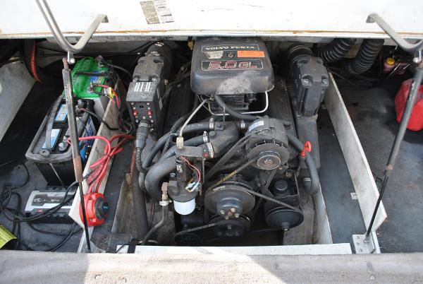 Slide: The Image of Engine compartment of a 1998 Cobalt 200 boat, featuring a Volvo 5.0 GL engine. - 33
