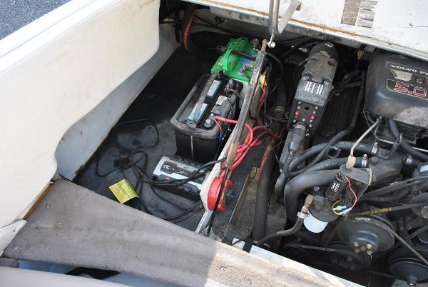 Slide: The Image of Engine compartment of a 1998 Cobalt 200 boat, showing battery and wiring. - 34