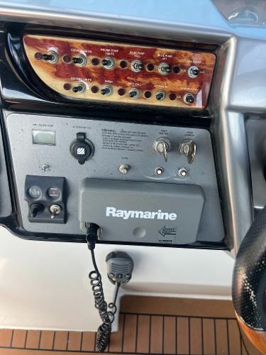 Slide: The Image of Control panel of a 2003 Cobalt 360 boat with Raymarine equipment. - 24
