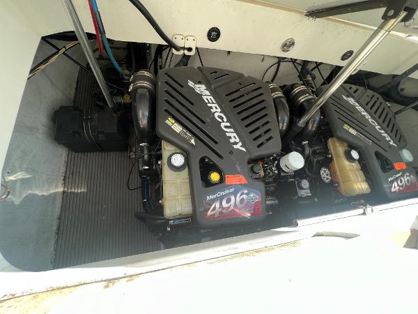 Slide: The Image of 2003 Cobalt 360 boat engine compartment with twin Mercury MerCruiser 496 engines. - 48