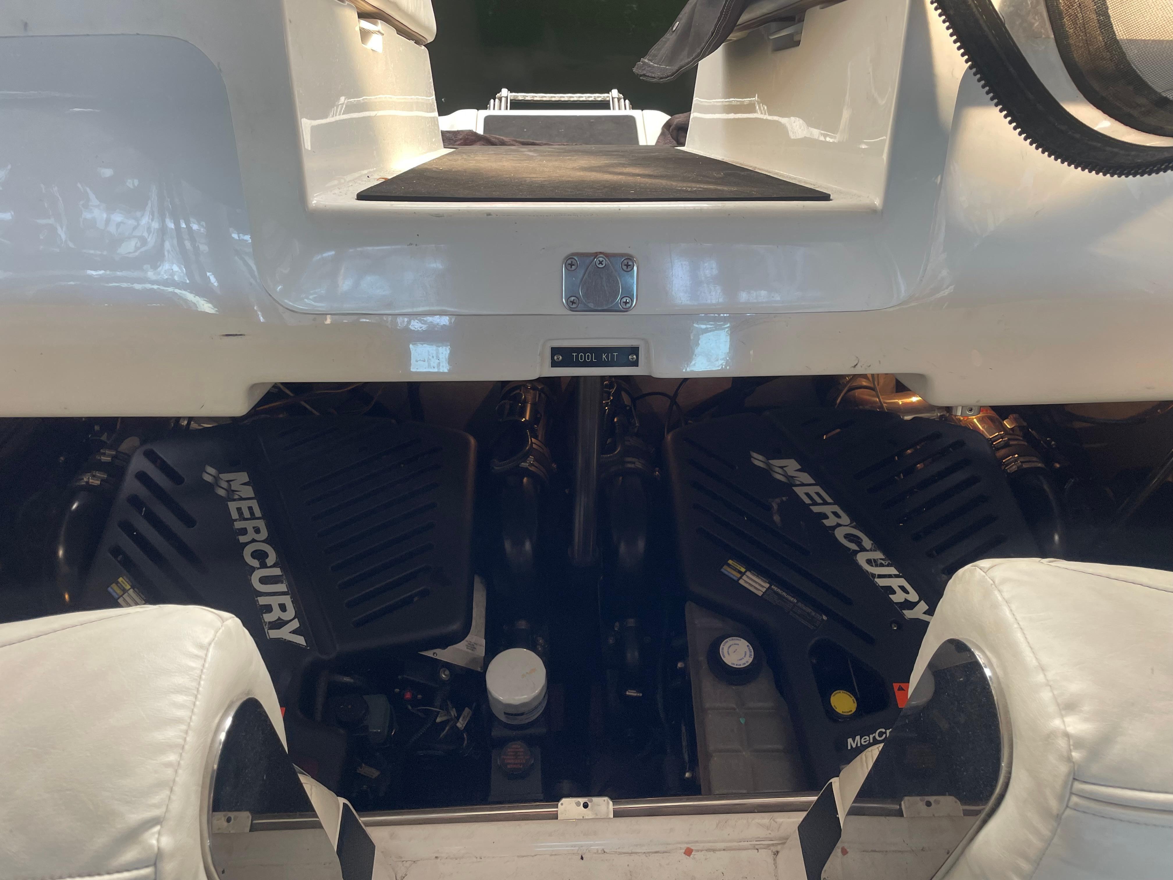 Slide: The Image of Engine compartment of a 2004 Cobalt 360 boat with Mercury engines visible. - 26