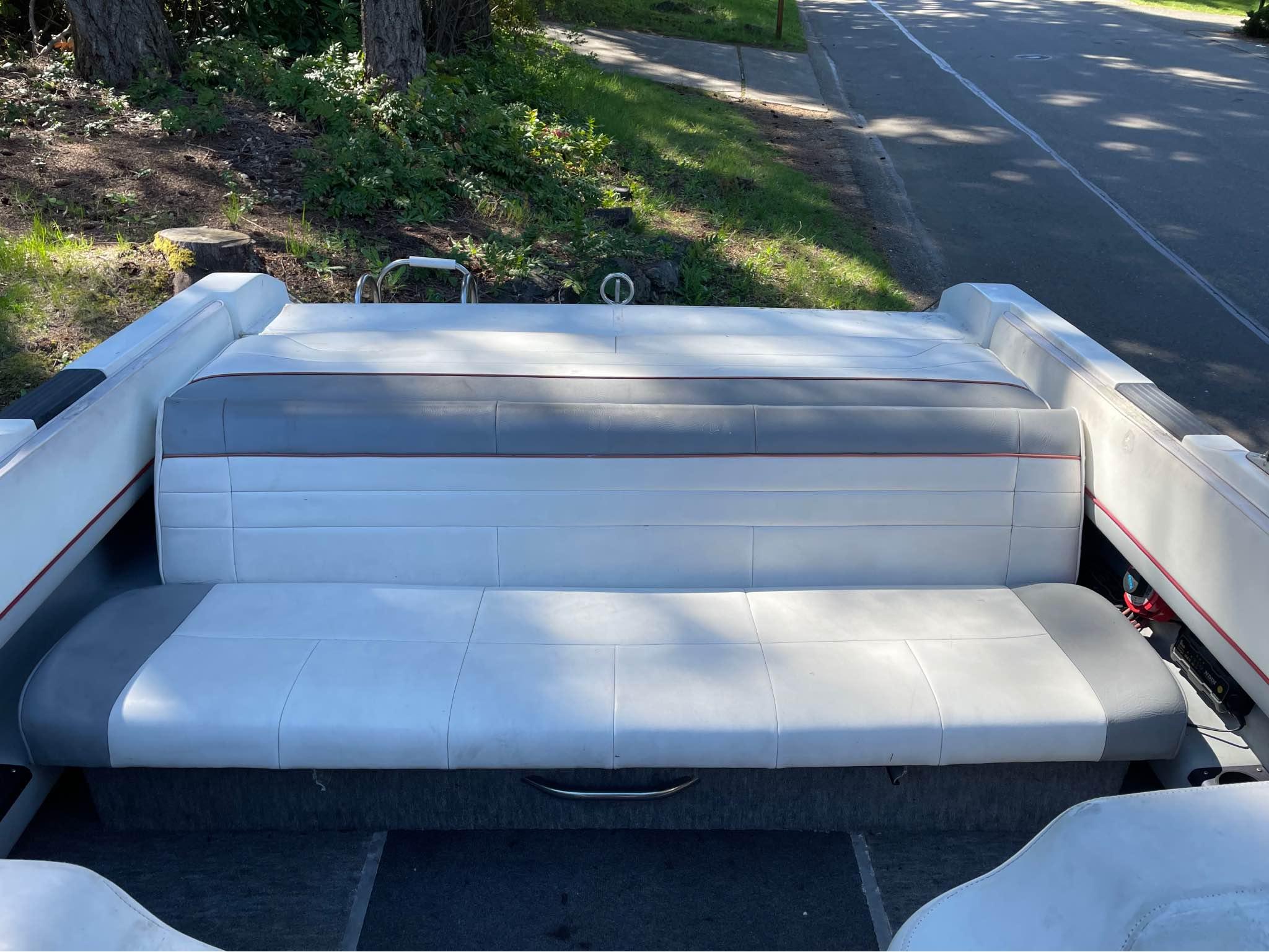 Slide: The Image of 1989 Cobalt CONDURRE boat interior with white and gray seating. - 6