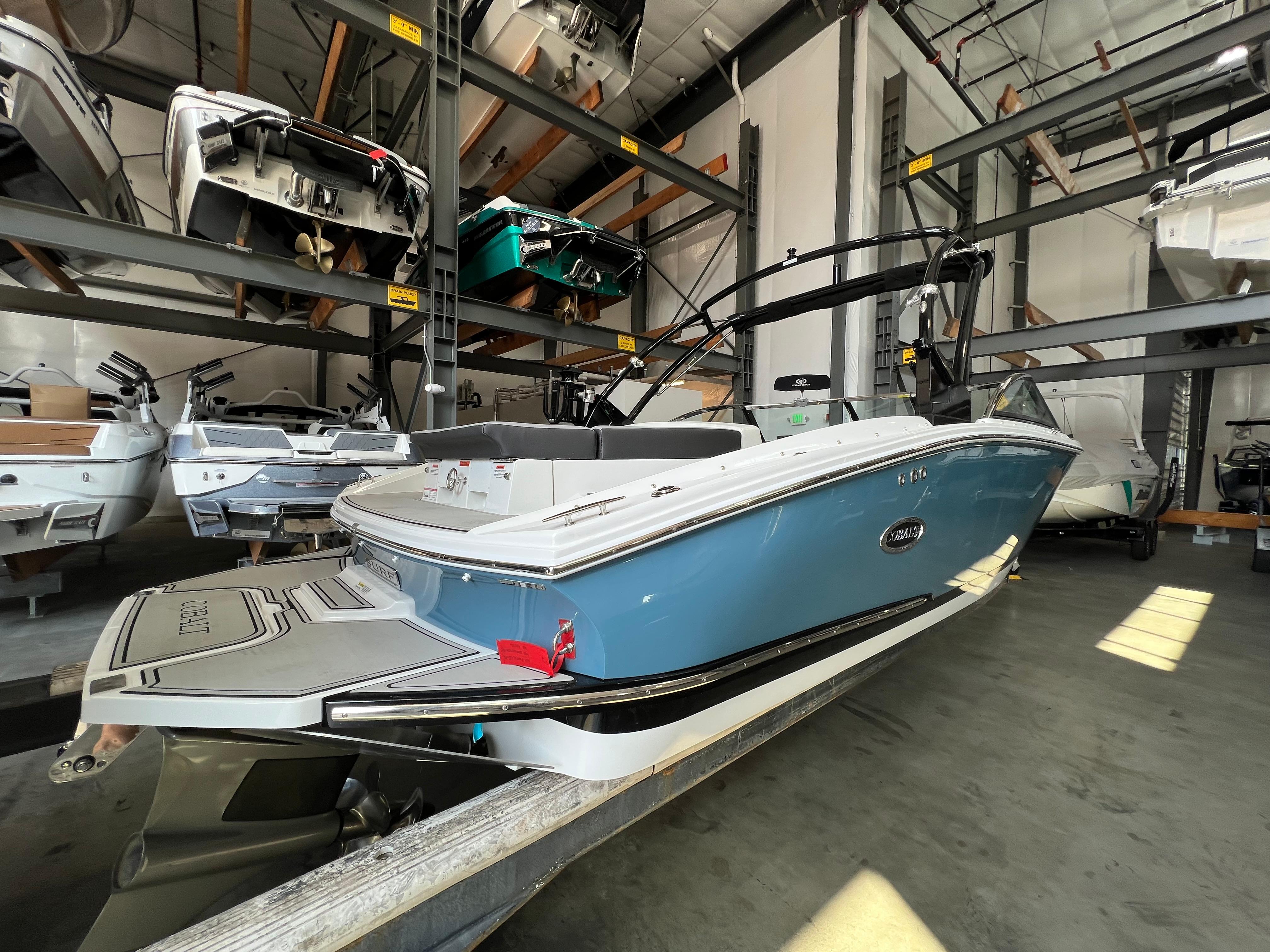 Slide: The Image of 2023 Cobalt CS23 Surf boat in storage facility. - 4
