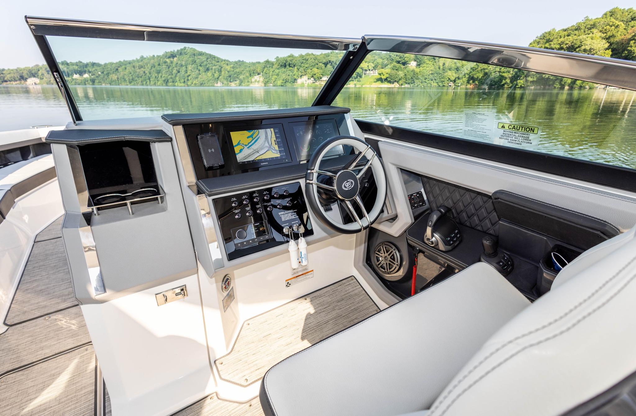 Slide: The Image of Interior of 2023 Cobalt R33 boat with modern dashboard and steering wheel. - 21