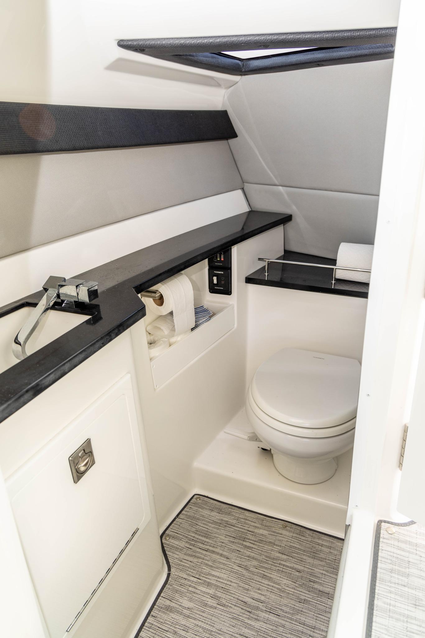 Slide: The Image of 2023 Cobalt R33 boat bathroom with modern fixtures and sleek design. - 28