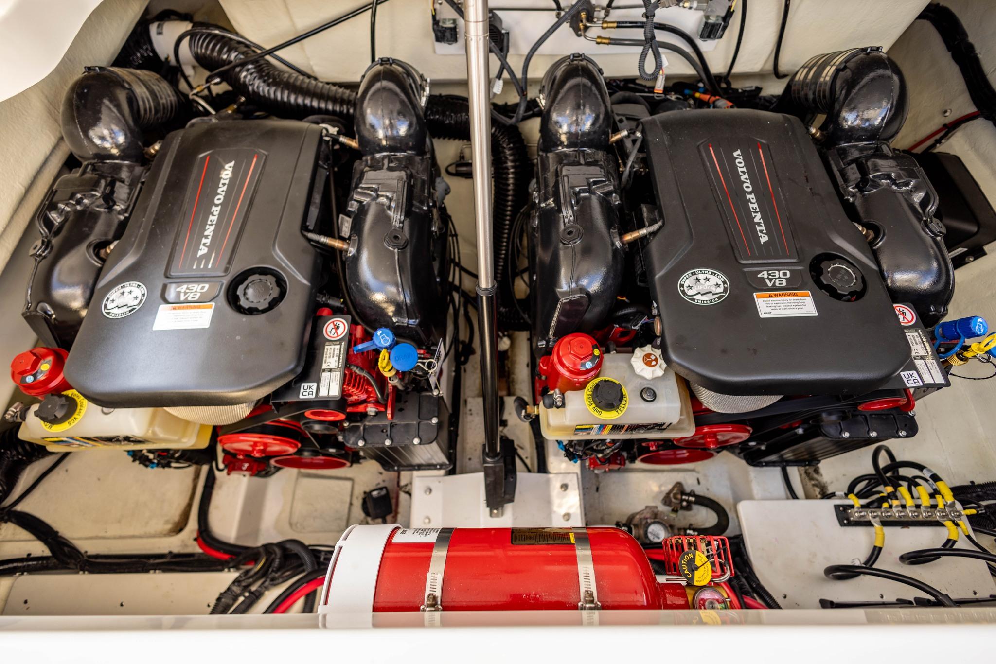 Slide: The Image of Twin Volvo Penta V8 engines in a 2023 Cobalt R33 boat engine compartment. - 29