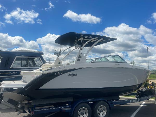 Slide: The Image of 2021 Cobalt R5 Surf boat on trailer under blue sky with clouds. - 1