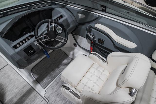 Slide: The Image of 2021 Cobalt R5 Surf boat interior with steering wheel and plush seating. - 21
