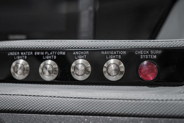 Slide: The Image of Control panel of 2021 Cobalt R5 Surf boat with light switches and surf system check. - 25