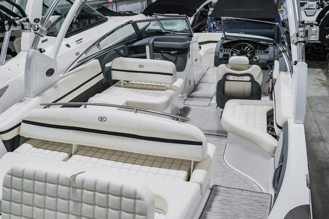 Slide: The Image of 2021 Cobalt R5 Surf boat interior with luxurious white seating and modern dashboard. - 5