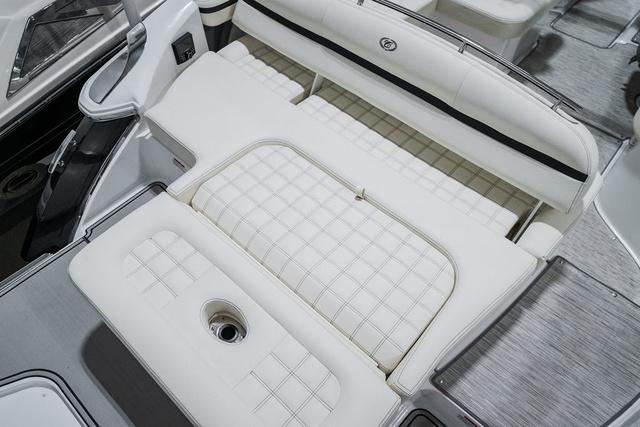 Slide: The Image of 2021 Cobalt R5 Surf boat interior with white cushioned seating and sleek design. - 9