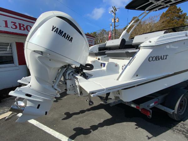 Slide: The Image of 2024 Cobalt R8 Outboard boat with Yamaha engine, parked on a trailer. - 11