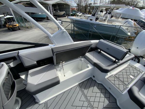 Slide: The Image of 2024 Cobalt R8 Outboard boat interior with open storage compartment. - 18