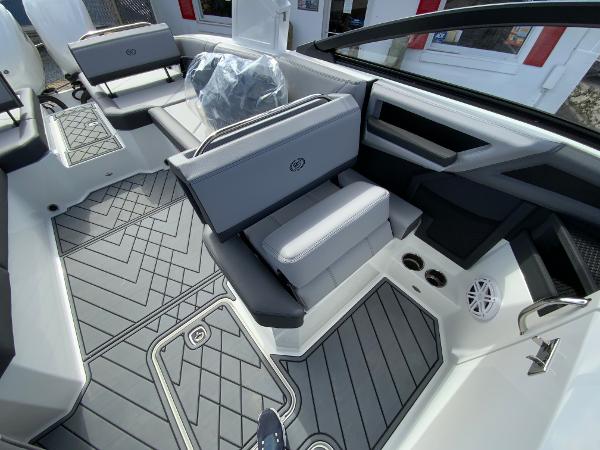 Slide: The Image of 2024 Cobalt R8 Outboard boat interior with gray seating and modern design. - 23