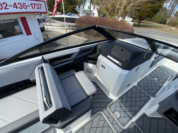 Slide: The Image of 2024 Cobalt R8 Outboard boat interior with modern seating and dashboard. - 25