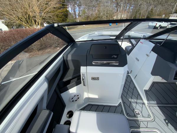 Slide: The Image of 2024 Cobalt R8 Outboard boat interior with modern dashboard and seating. - 26
