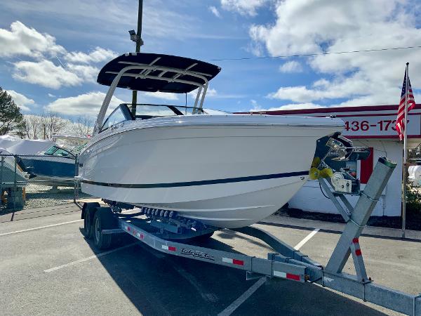 Slide: The Image of 2024 Cobalt R8 Outboard boat on a trailer in a parking lot. - 3