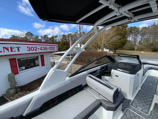 Slide: The Image of 2024 Cobalt R8 Outboard boat interior with modern seating and dashboard. - 33