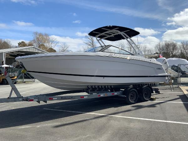 Slide: The Image of 2024 Cobalt R8 Outboard boat on a trailer in a parking lot. - 4