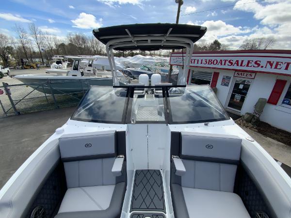 Slide: The Image of 2024 Cobalt R8 Outboard boat at a dealership, front seating area view. - 44