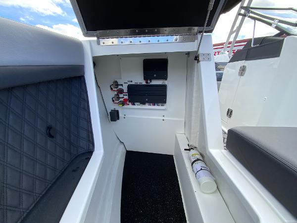 Slide: The Image of 2024 Cobalt R8 Outboard boat interior with electrical panel and fire extinguisher. - 45