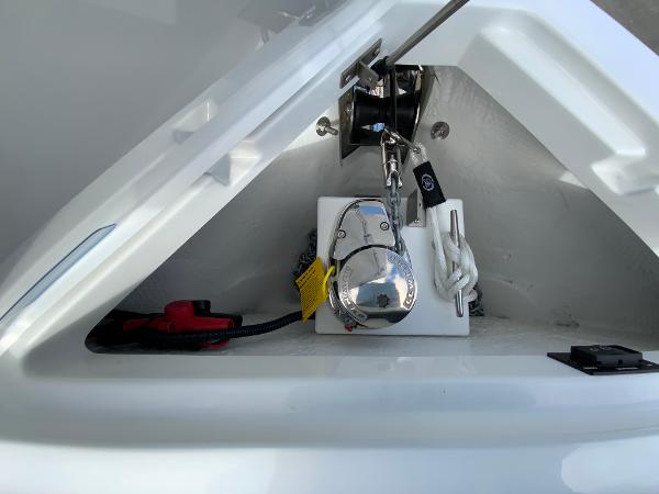 Slide: The Image of 2024 Cobalt R8 Outboard anchor compartment with winch and chain. - 46