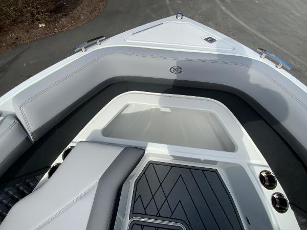 Slide: The Image of 2024 Cobalt R8 Outboard boat interior, front seating area with storage compartment. - 47