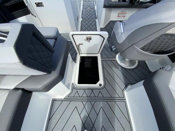 Slide: The Image of 2024 Cobalt R8 Outboard boat interior with open storage compartment and modern seating. - 49