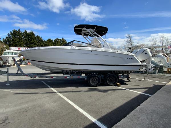 Slide: The Image of 2024 Cobalt R8 Outboard boat on a trailer in a parking lot. - 5