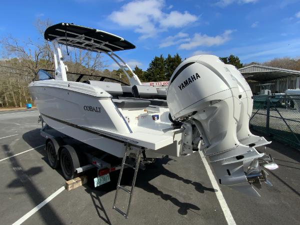 Slide: The Image of 2024 Cobalt R8 Outboard boat with Yamaha engine on trailer in parking lot. - 7
