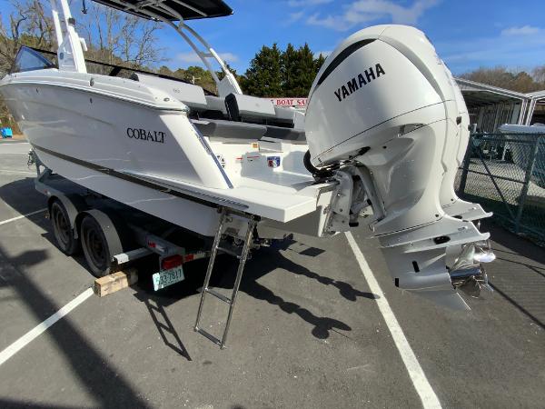 Slide: The Image of 2024 Cobalt R8 Outboard boat with Yamaha engine on trailer in parking lot. - 8