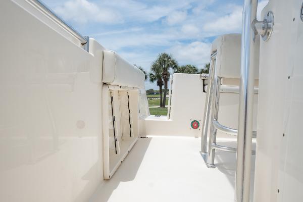 Slide: The Image of 2021 Cobia 201 Center Console boat interior with seating and storage compartments. - 12