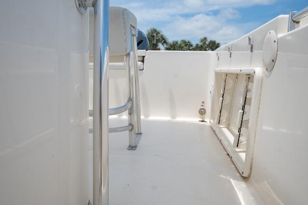 Slide: The Image of 2021 Cobia 201 Center Console boat deck with seating and storage. - 13