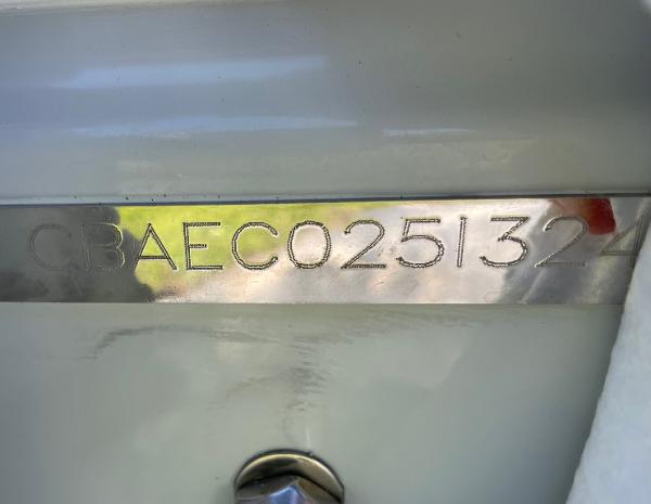 Slide: The Image of 2024 Cobia 262 Center Console boat hull identification number (HIN) plate. - 11