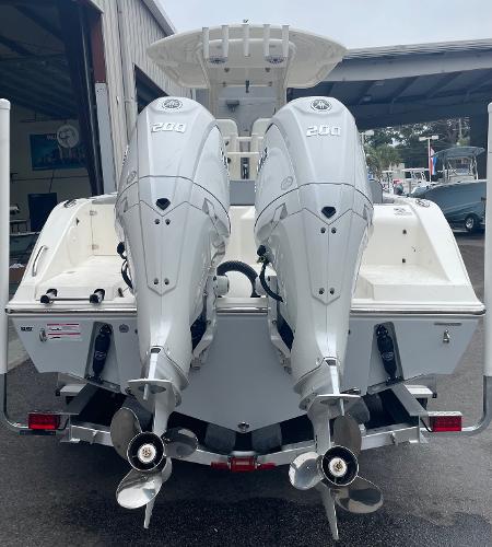 Slide: The Image of 2024 Cobia 262 Center Console with twin 200 horsepower engines. - 2