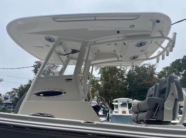 Slide: The Image of 2024 Cobia 262 Center Console boat with T-top and seating. - 3