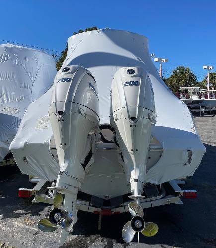 Slide: The Image of 2024 Cobia 262 Center Console boat with twin 200 HP engines. - 9