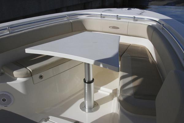 Slide: The Image of Manufacturer Provided Image: 2019 Cobia 277 Center Console boat with seating area and table. - 32