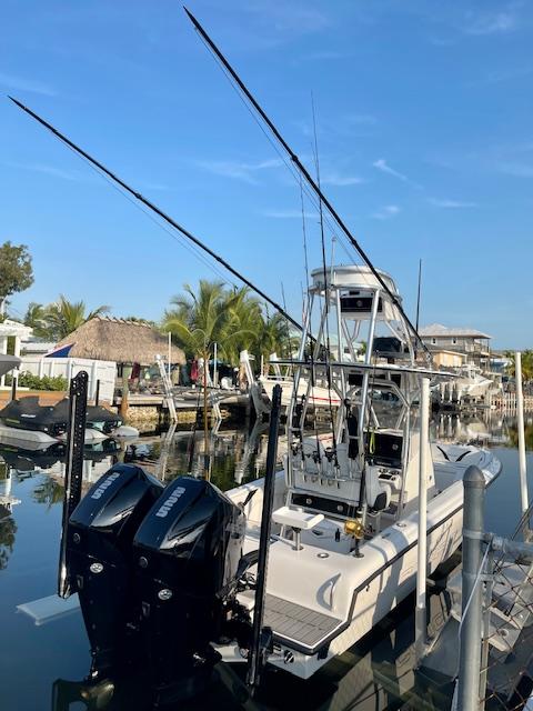 Slide: The Image of 2023 Concept 27 fishing boat docked with dual outboard motors. - 0
