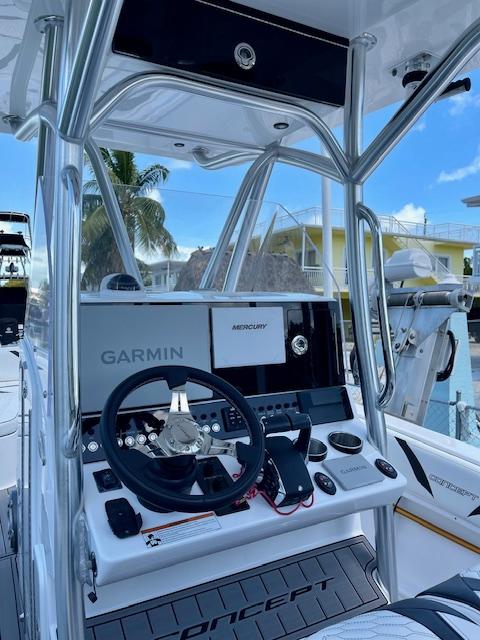 Slide: The Image of Concept 27 boat dashboard with Garmin and Mercury controls, 2023 model. - 2