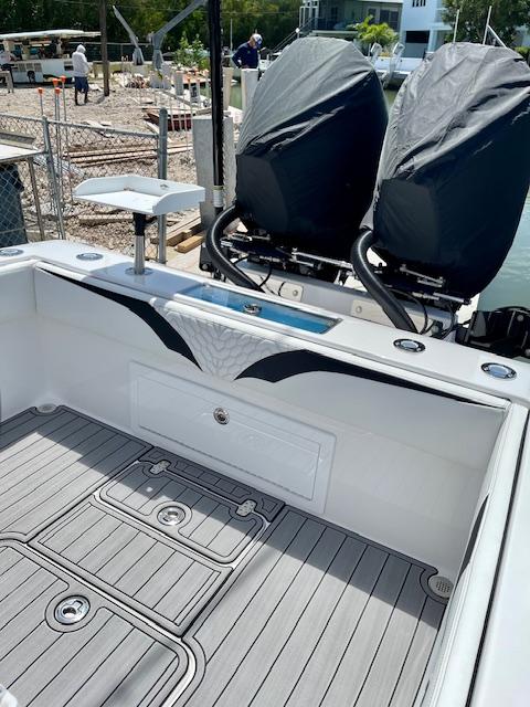 Slide: The Image of 2023 Concept 27 boat with dual outboard motors and spacious deck. - 3
